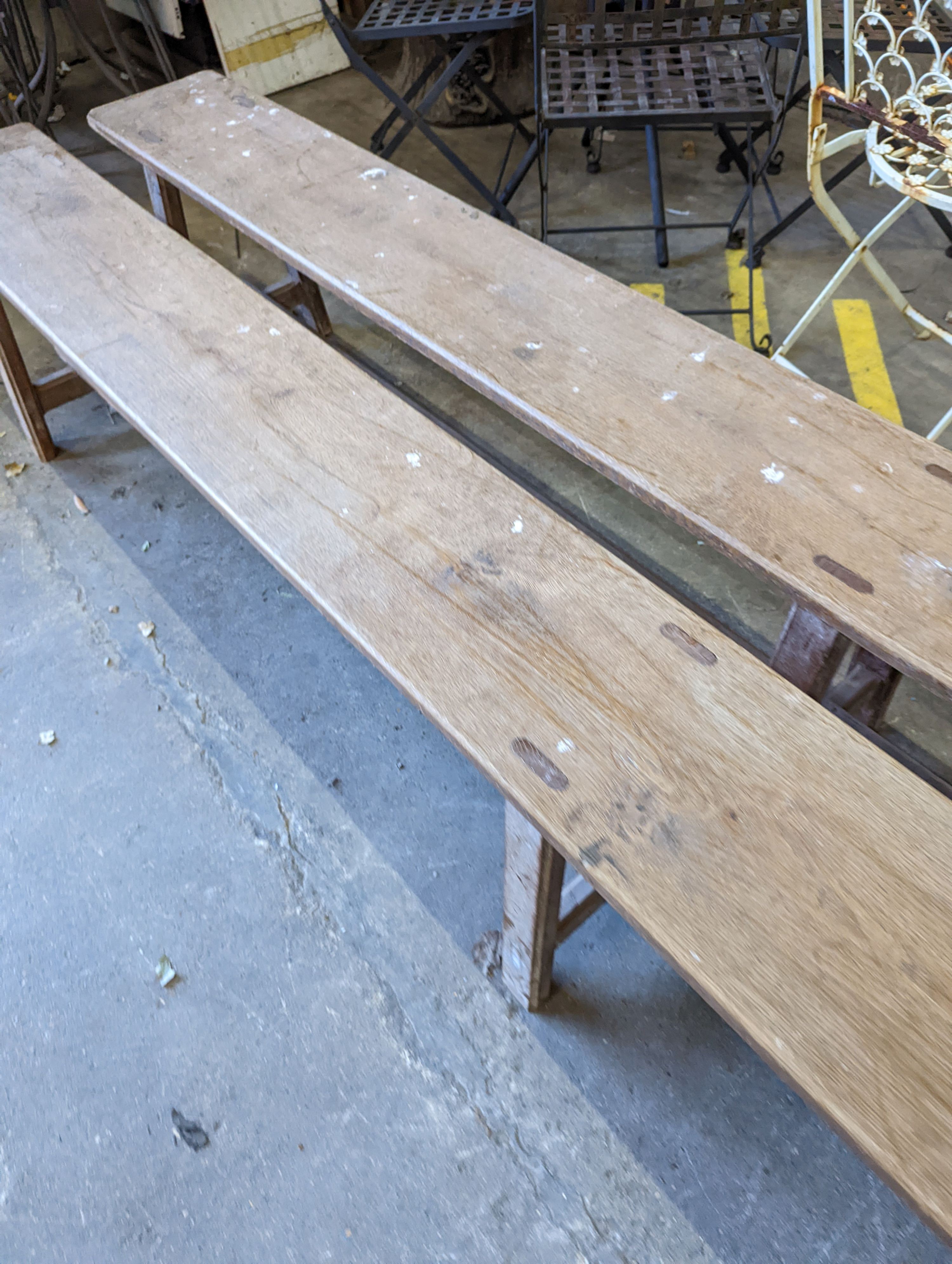 A pair of 19th century French provincial oak long bench seats, length 300cm, depth 24cm, height 45cm